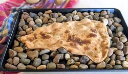 ویدیوی جالب از پخت نان سنگ به روش چینی ها 